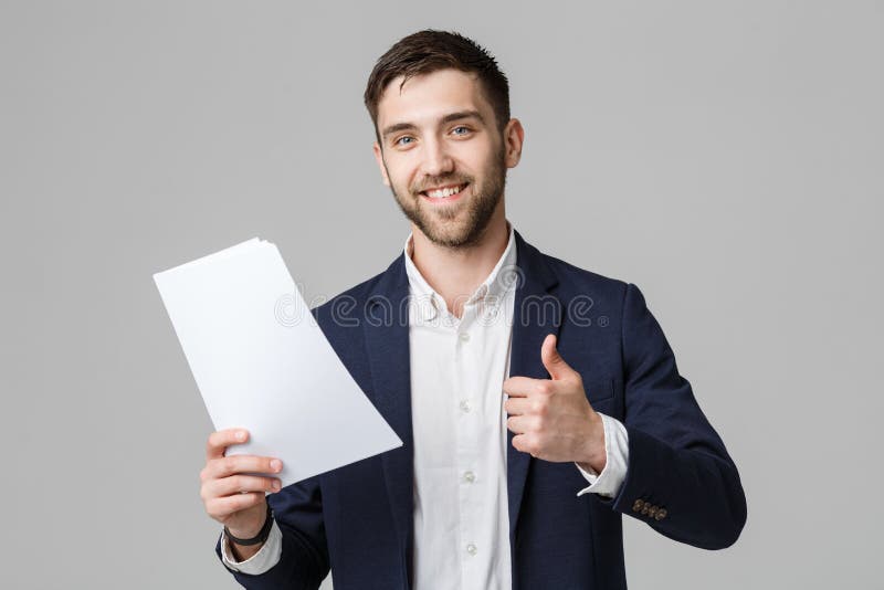 企业概念-举行与确信的微笑的面孔和重击的画象英俊的商人白色报告 奶油被装载的饼干 库存照片 企业概念-举行与确信的微笑的面孔和重击的画象英俊的商人白色报告 奶油被装载的饼干 库存照片