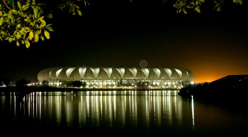 Port Elizabeth Soccer Stadium at Night with lights reflecting on the water. Port Elizabeth Soccer Stadium at Night with lights reflecting on the water