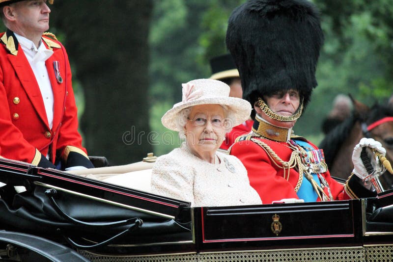 QUEEN ELIZABETH & Prince Philip London, England - June 13, 2015: Queen Elizabeth II in an open carriage with Prince Philip, Duke of Edinburgh for trooping the colour 2015 to mark the Queens official birthday, London, UK stock, photo, photograph, image, picture. QUEEN ELIZABETH & Prince Philip London, England - June 13, 2015: Queen Elizabeth II in an open carriage with Prince Philip, Duke of Edinburgh for trooping the colour 2015 to mark the Queens official birthday, London, UK stock, photo, photograph, image, picture