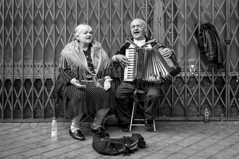 Couple of old people singing and playing in Madrid. Couple of old people singing and playing in Madrid