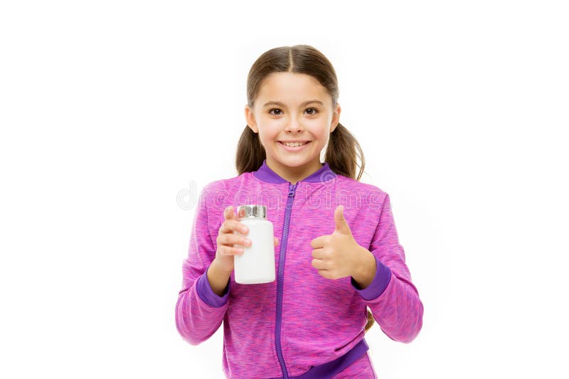 健康儿童维生素罐 运动和饮食都有好结果 小女孩维生素补充剂 被白色隔离的小孩 库存图片 健康儿童维生素罐 运动和饮食都有好结果 小女孩维生素补充剂 被白色隔离的小孩 库存图片