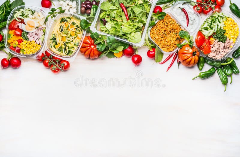 Healthy food concept. Variety of vegetables salad bowls in plastic package on white wooden background, top view, border. Salad bar. Take away Diet lunch ideas. Healthy food concept. Variety of vegetables salad bowls in plastic package on white wooden background, top view, border. Salad bar. Take away Diet lunch ideas