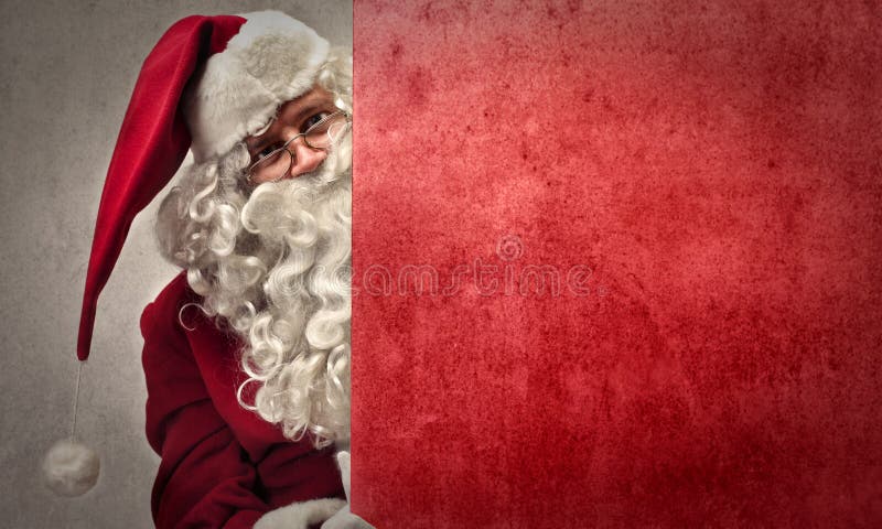 Santa Claus holding a red cardboard. Santa Claus holding a red cardboard