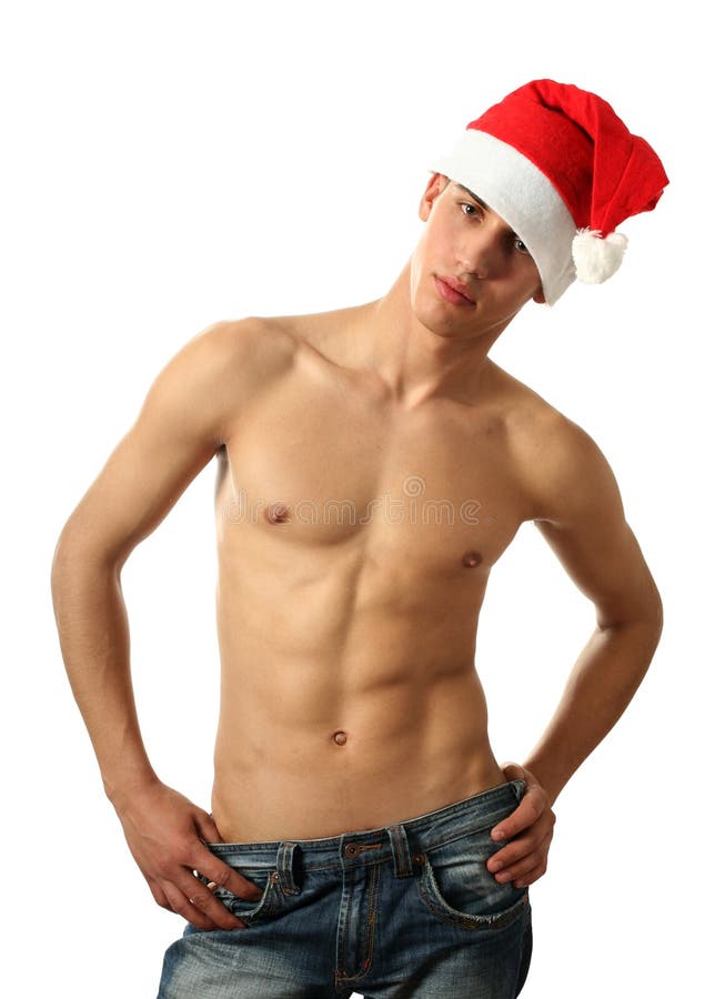 muscular man wearing a Santa Claus hat isolated on white. muscular man wearing a Santa Claus hat isolated on white