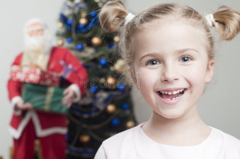 Happy little girl waiting for Santa Claus. Happy little girl waiting for Santa Claus