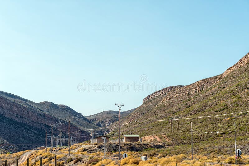 Electrified railroad and a power substation in the Hex River Valley in the Western Cape Province. Electrified railroad and a power substation in the Hex River Valley in the Western Cape Province