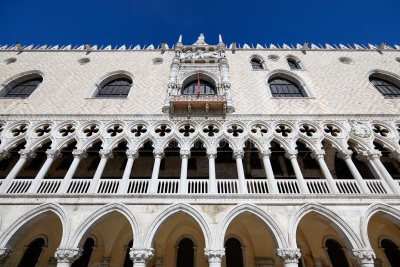 Doge Palace building facade in Venice, low angle view in a sunny summer day in Italy. Doge Palace building facade in Venice, low angle view in a sunny summer day in Italy