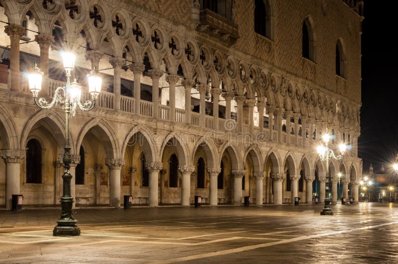 Doge palace at night in Venice italy with star burst on street lamps. No people in piazza. Doge palace at night in Venice italy with star burst on street lamps. No people in piazza