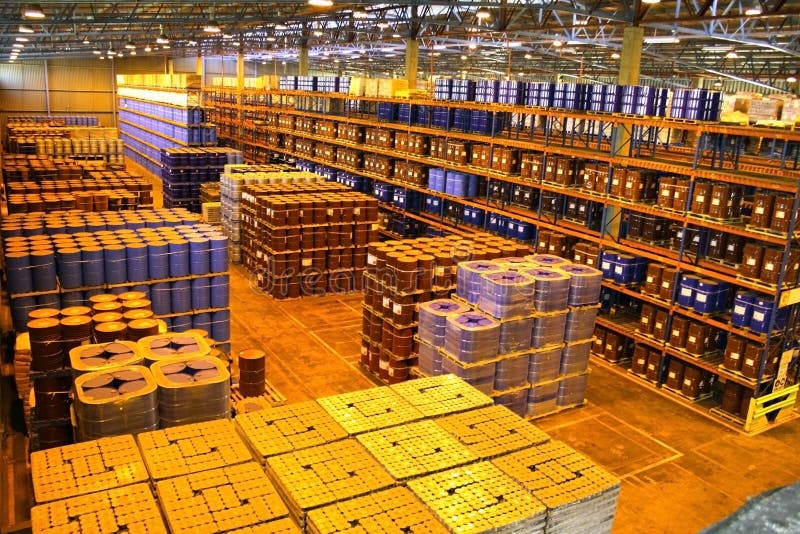 Large warehouse with tall shelves with tins and bags. Large warehouse with tall shelves with tins and bags