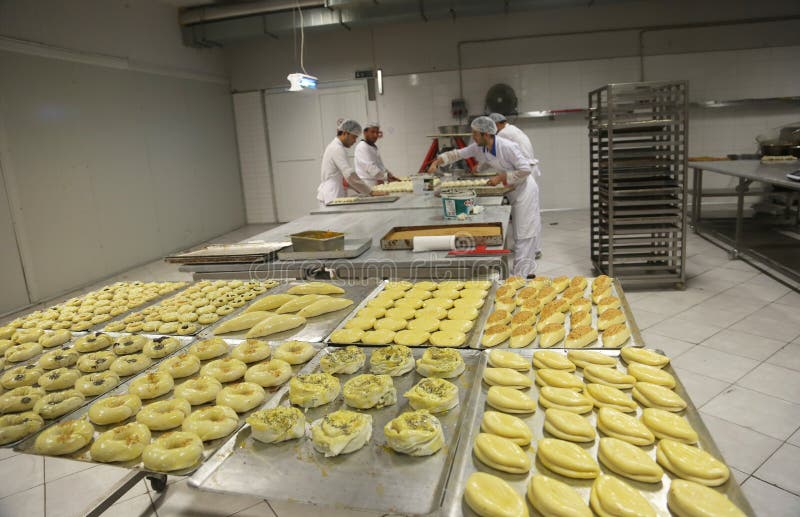 ISTANBUL, TURKEY - AUGUST 10: Turkish chefs making unbaked foods in the baker factory on August 10, 2017 in Istanbul, Turkey. ISTANBUL, TURKEY - AUGUST 10: Turkish chefs making unbaked foods in the baker factory on August 10, 2017 in Istanbul, Turkey.