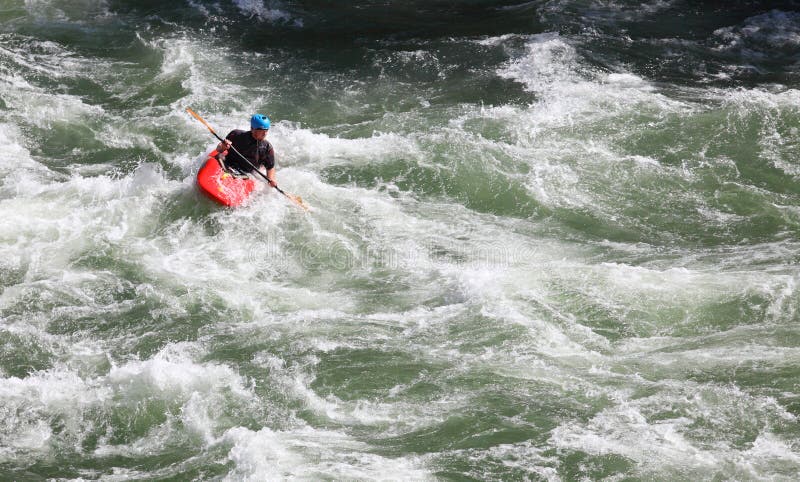 Jackson, Wyoming, USA  July 22, 2014 An experienced kayaker challenges the rapids of the South Fork of the Snake River, near Jackson, Wyoming. Jackson, Wyoming, USA  July 22, 2014 An experienced kayaker challenges the rapids of the South Fork of the Snake River, near Jackson, Wyoming