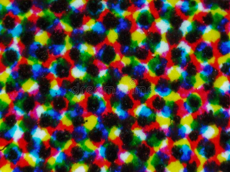 Light photomicrograph of colour halftone print dots seen through a microscope. Light photomicrograph of colour halftone print dots seen through a microscope