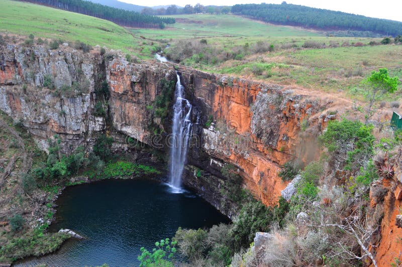 South Africa, 01/10/2009: view of the Mac Mac Falls, a 65 meters high waterfall in the Mac Mac River, a declared National Monument along the Sabie Waterfalls Route. South Africa, 01/10/2009: view of the Mac Mac Falls, a 65 meters high waterfall in the Mac Mac River, a declared National Monument along the Sabie Waterfalls Route