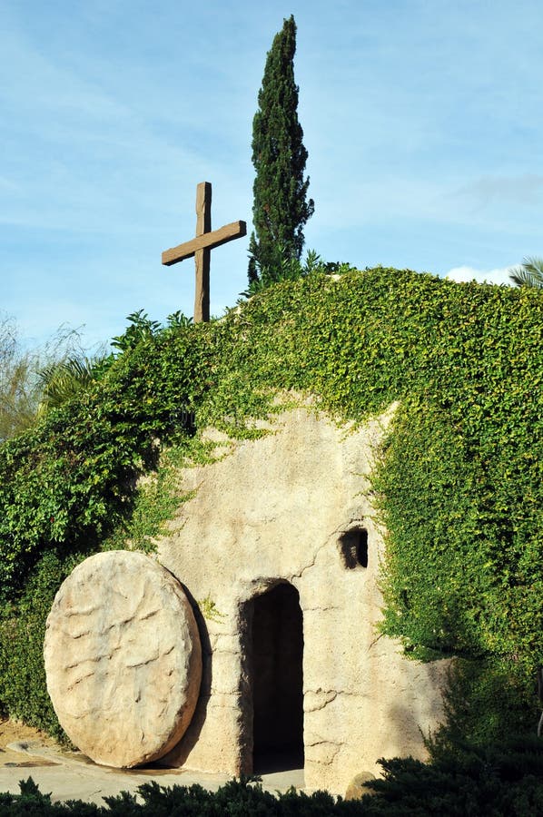 The outside of a replica of the Garden Tomb where Jesus was buried, the stone rolled away from the entrance. The outside of a replica of the Garden Tomb where Jesus was buried, the stone rolled away from the entrance.