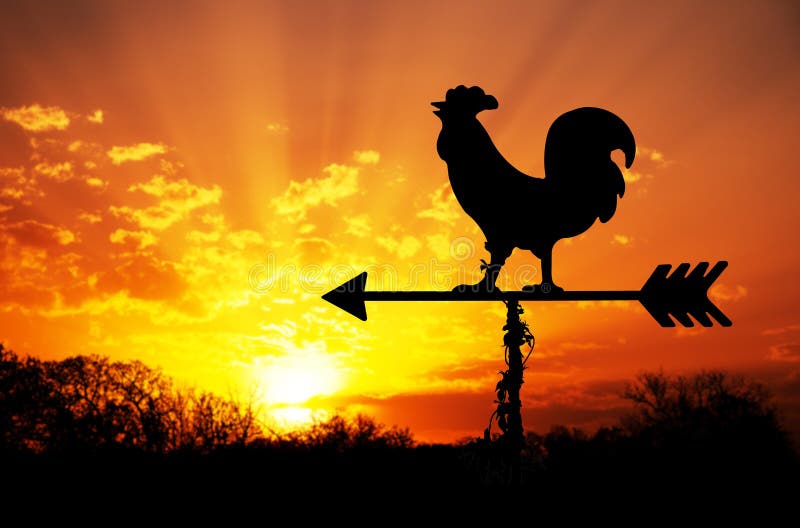 Rooster weathervane against sunrise with bright colors in clouds, concept for early morning wake up. Rooster weathervane against sunrise with bright colors in clouds, concept for early morning wake up