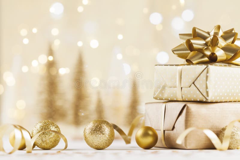 Christmas gift box against golden bokeh background. Holiday card. Christmas gift box against golden bokeh background. Holiday card.