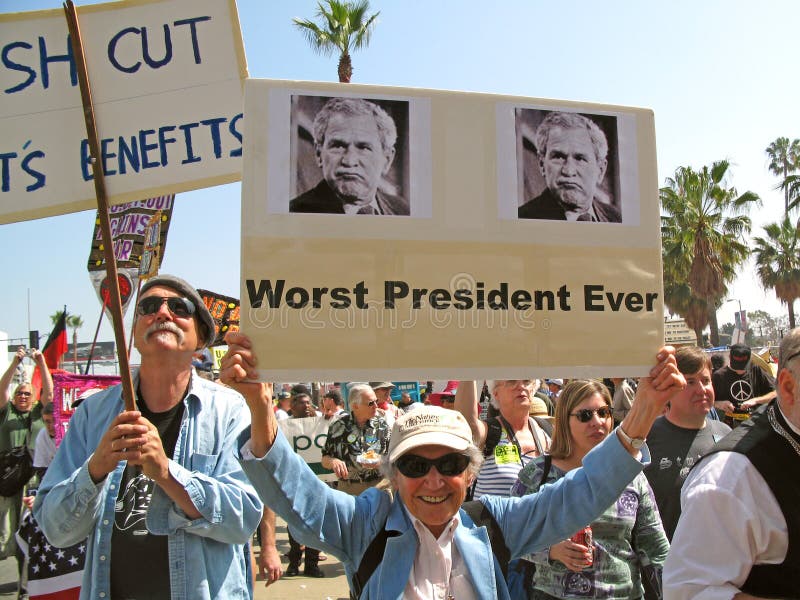 Demonstrators display signs at an anti-war rally on Hollywood Boulevard in Hollywood, California, on March 17, 2007. This elderly woman holds a sign that says Worst President Ever with President Bush pictured. Demonstrators display signs at an anti-war rally on Hollywood Boulevard in Hollywood, California, on March 17, 2007. This elderly woman holds a sign that says Worst President Ever with President Bush pictured.