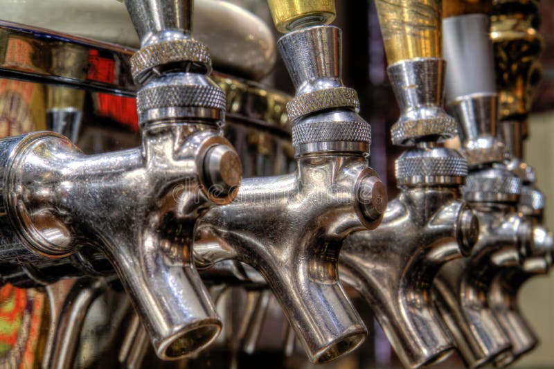 Beer taps captured up close at the Yuengling Brewery in Pottsville, PA. Beer taps captured up close at the Yuengling Brewery in Pottsville, PA.