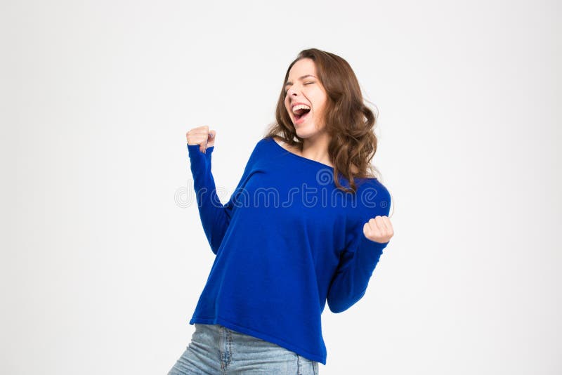 呼喊和庆祝成功的激动的高兴少妇 库存图片 呼喊和庆祝成功的激动的高兴少妇 库存图片