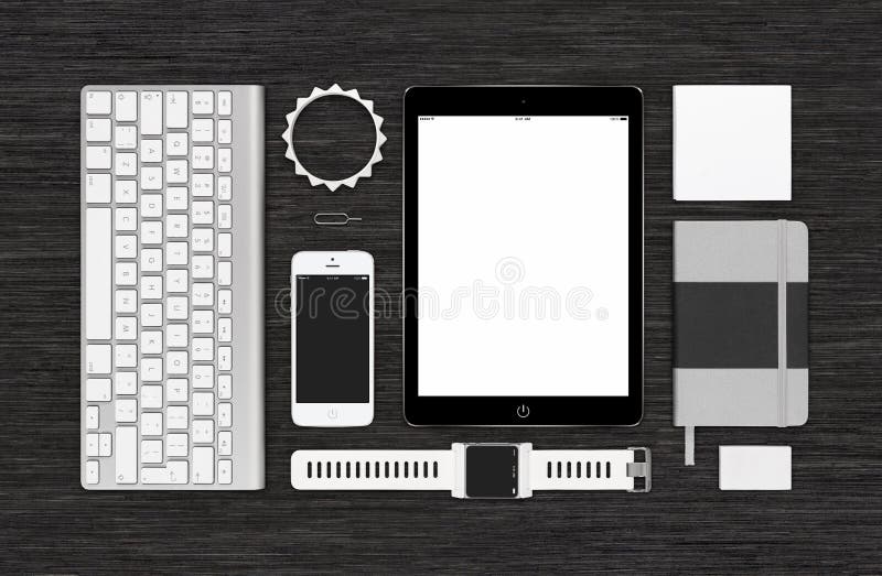 Top view of branding identity technology mockup for design presentation or portfolio on black desk. Template includes tablet computer, smart watch, smartphone, keyboard, bracelet, notebook, eraser, reminder. Top view of branding identity technology mockup for design presentation or portfolio on black desk. Template includes tablet computer, smart watch, smartphone, keyboard, bracelet, notebook, eraser, reminder.