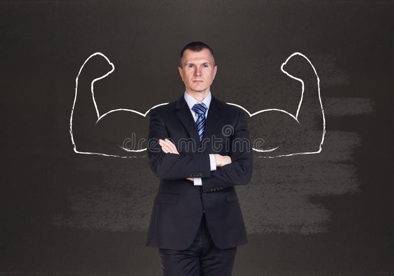 Businessman with drawn powerful hands. Black chalkboard background. Businessman with drawn powerful hands. Black chalkboard background.