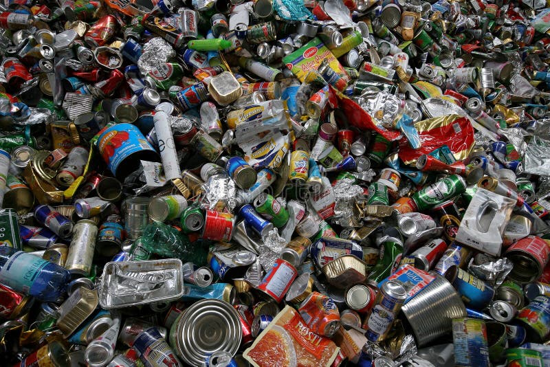 RECYCLING TINS IN A LANDFILL. RECYCLING TINS IN A LANDFILL