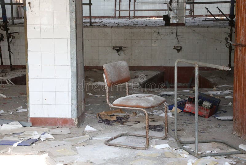 abandoned interior of an old factory closed due to the economic crisis. abandoned interior of an old factory closed due to the economic crisis