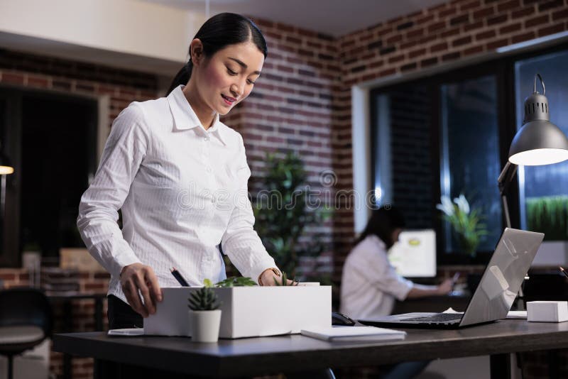 Dismissed business company employee putting personal stuff in cardboard box because of project failure. Fired businesswoman packing personal belongings because of workplace financial problems. Dismissed business company employee putting personal stuff in cardboard box because of project failure. Fired businesswoman packing personal belongings because of workplace financial problems.