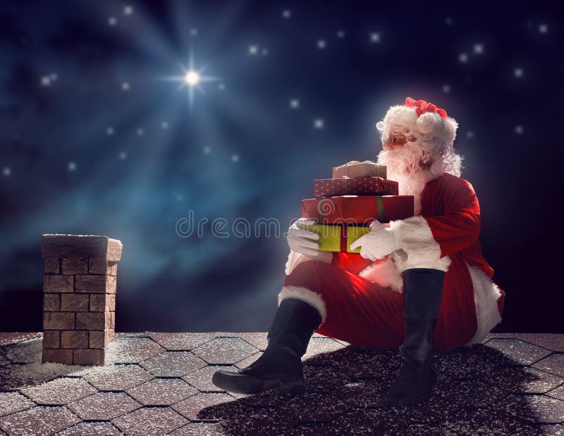 Merry Christmas and happy holidays! Santa Claus sitting on the roof of the house and puts the presents in the chimney. Christmas legend concept. Merry Christmas and happy holidays! Santa Claus sitting on the roof of the house and puts the presents in the chimney. Christmas legend concept.