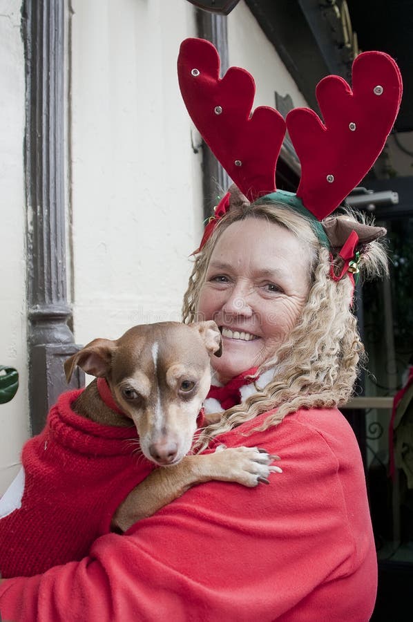 Unidentified woman with dog at Christmas parade in Hollywood on December 17, Los Angeles, CA. Unidentified woman with dog at Christmas parade in Hollywood on December 17, Los Angeles, CA