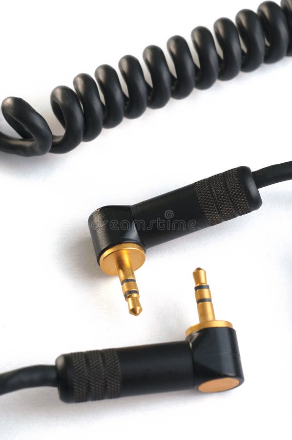 Black audio cable with two gold stereo plugs 3,5mm isolated on white closeup. Black audio cable with two gold stereo plugs 3,5mm isolated on white closeup