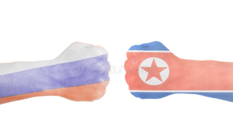 North Korean and Russian flags painted on two clenched fists isolated white background. North Korean and Russian flags painted on two clenched fists isolated white background