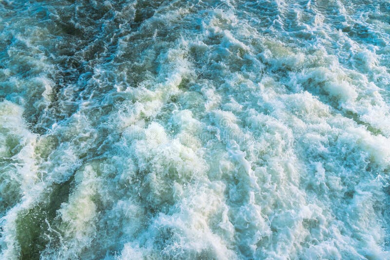 Close-up of extremely turbulent whitewater rapids on river, viewed from above. Close-up of extremely turbulent whitewater rapids on river, viewed from above.