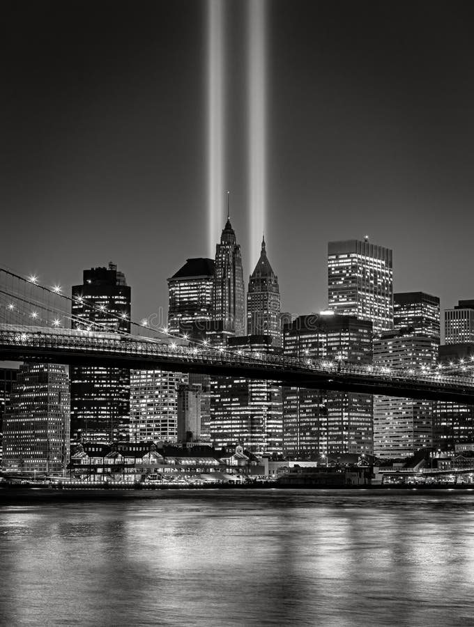 Twin beacons of light known as The Tribute in Light, in Lower Manhattan, New York City, commemorating the events of September 11. Illuminated skyscrapers of the Financial District and the Brooklyn Bridge reflect on the East River. Twin beacons of light known as The Tribute in Light, in Lower Manhattan, New York City, commemorating the events of September 11. Illuminated skyscrapers of the Financial District and the Brooklyn Bridge reflect on the East River.