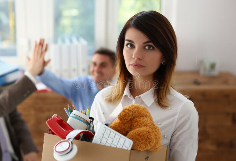 Sad dismissed women against background of joyful colleagues partners in office. Stressed young lady having nervous breakdown after getting fired. Sad dismissed women against background of joyful colleagues partners in office. Stressed young lady having nervous breakdown after getting fired