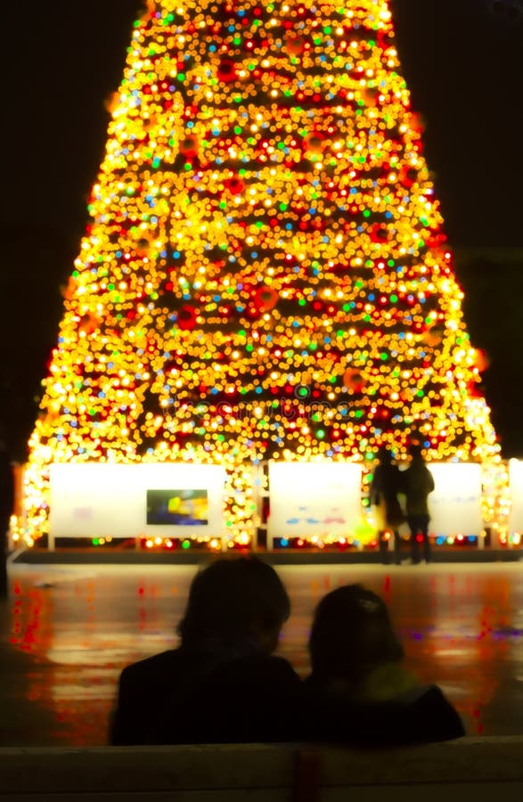 couples watching huge Christmas tree decoration together on xmas eve. Nagoya port, Aichi, Japan. couples watching huge Christmas tree decoration together on xmas eve. Nagoya port, Aichi, Japan.