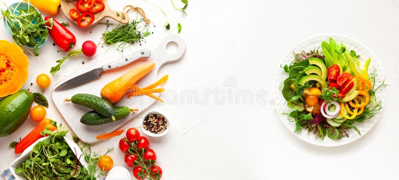 Fresh vegetables, fruits, microgreens and herbs for cooking healthy food at home. Clean eating, salad bowl. Top view. Fresh vegetables, fruits, microgreens and herbs for cooking healthy food at home. Clean eating, salad bowl. Top view.