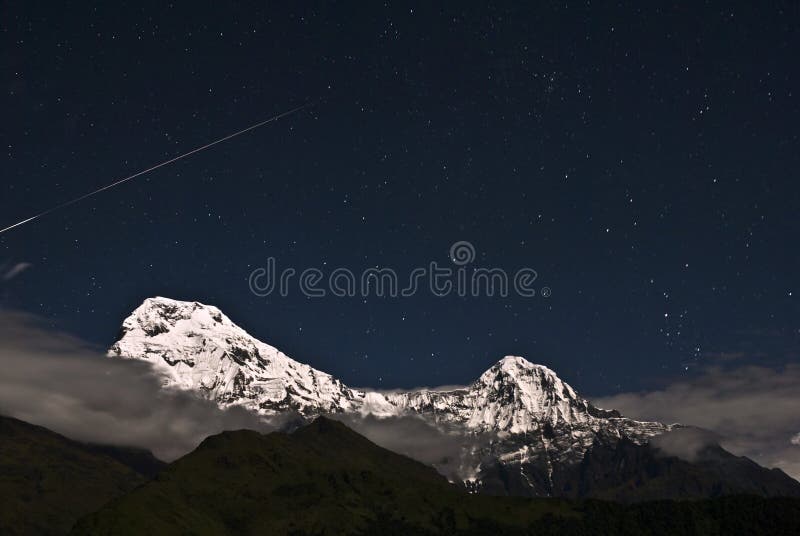 Shooting star over the snow mountain,night,Annapurna South, Himalaya,Nepal. Shooting star over the snow mountain,night,Annapurna South, Himalaya,Nepal
