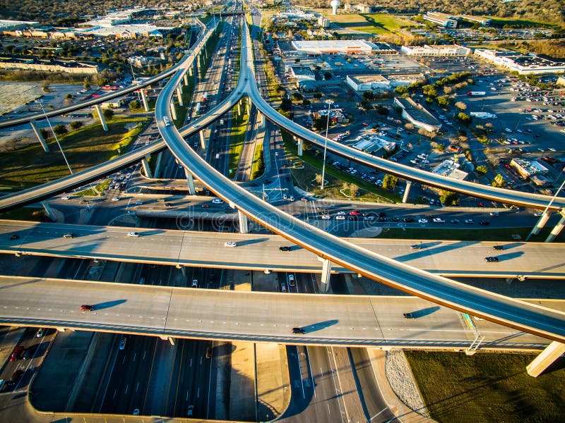 Aerial High View over texas Highway Exchange Overpass Traffic Transportation Urban Sprawl Over South Congress Looking Further East Ubran Industrial Austin Texas 2016 Skyline Aerial Curved Condos Modern Architecture Dramatic Sunset Austin Texas 2016 Skyline View Aerial Over Congress avenue with Town Lake making gorgeous colorful reflections of the sky. The Frost Bank tower and the Austonian Standing high with office buildings and the line of Newly Constructed Condos line the north side of the Colorado river in Downtown ATX. Aerial High View over texas Highway Exchange Overpass Traffic Transportation Urban Sprawl Over South Congress Looking Further East Ubran Industrial Austin Texas 2016 Skyline Aerial Curved Condos Modern Architecture Dramatic Sunset Austin Texas 2016 Skyline View Aerial Over Congress avenue with Town Lake making gorgeous colorful reflections of the sky. The Frost Bank tower and the Austonian Standing high with office buildings and the line of Newly Constructed Condos line the north side of the Colorado river in Downtown ATX.