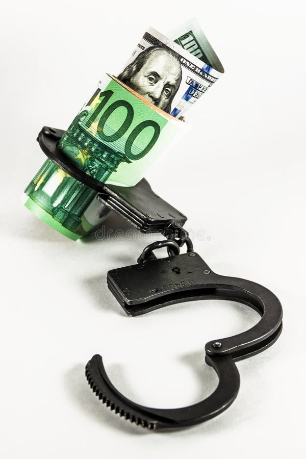 Dollars and euros in handcuffs. Dollars and euros in handcuffs