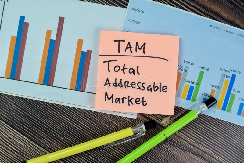 Concept of TAM - Total Addressable Market write on sticky notes isolated on Wooden Table. Concept of TAM - Total Addressable Market write on sticky notes isolated on Wooden Table