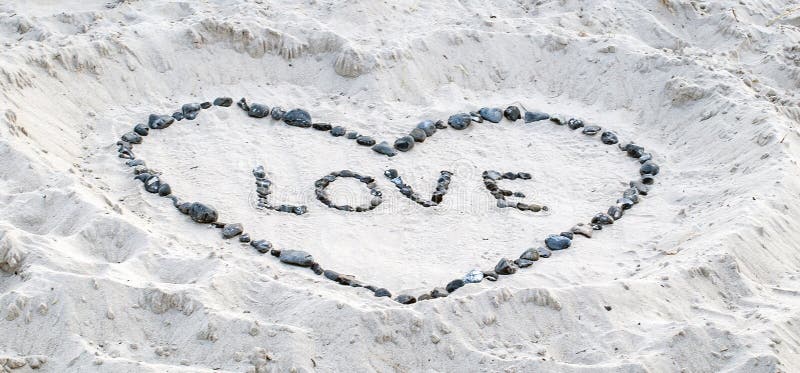 Love proof in the sand with stones. Love proof in the sand with stones