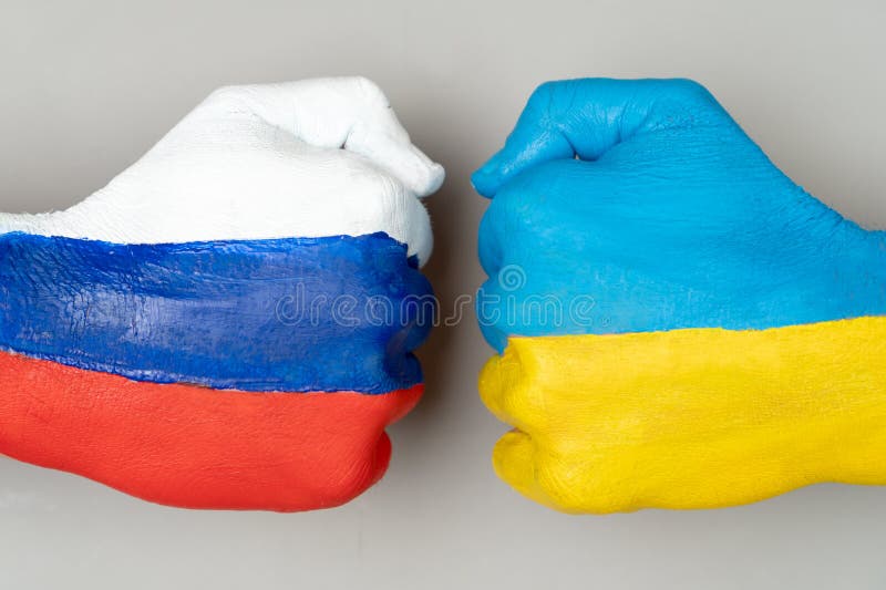 Flags of Ukraine and Russia Flag on hands punch to each others on light gray world map background, Ukraine vs Russia in world war crisis concept. Flags of Ukraine and Russia Flag on hands punch to each others on light gray world map background, Ukraine vs Russia in world war crisis concept.