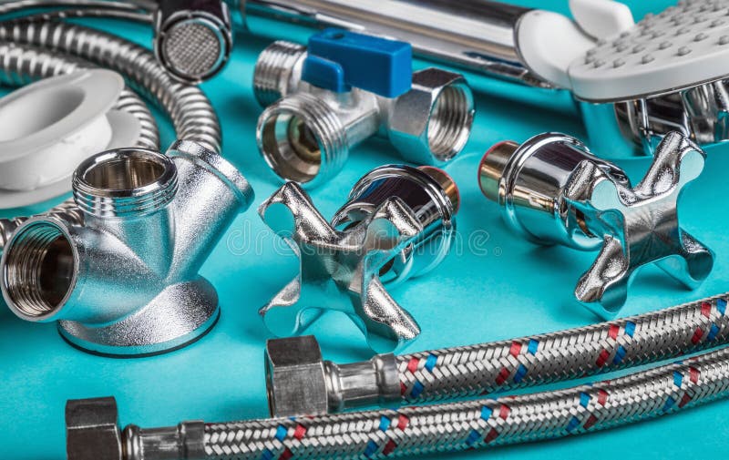 Different plumbing fixtures for use in the bathroom and toilet room, in the kitchen on a blue background. Different plumbing fixtures for use in the bathroom and toilet room, in the kitchen on a blue background