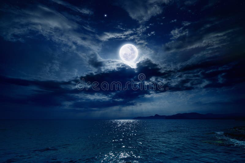 Night sky with full moon and reflection in sea, stars, beautiful clouds. Elements of this image furnished by NASA. Night sky with full moon and reflection in sea, stars, beautiful clouds. Elements of this image furnished by NASA