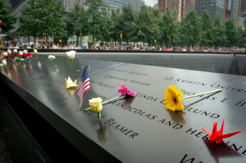 New York City, NY - September 11, 2018 : The 9/11 Memorial during Patriot Day, National Day of Prayer and Remembrance for the Victims of the terrorist attacks on September 11, 2001 in New York, USA. New York City, NY - September 11, 2018 : The 9/11 Memorial during Patriot Day, National Day of Prayer and Remembrance for the Victims of the terrorist attacks on September 11, 2001 in New York, USA