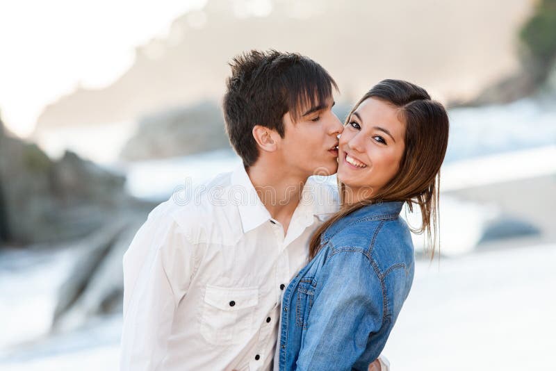 Close up of handsome teen couple in love on beach. Close up of handsome teen couple in love on beach.