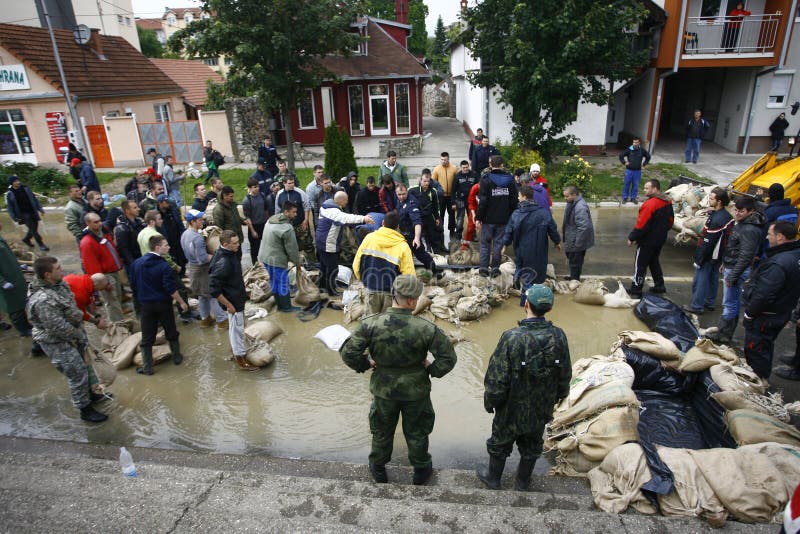 SERBIA, SREMSKA MITROVICA - MAY 17: The army, police and citizens together raise the walls banks with sandbags.The water level of Sava River remains high in worst flooding on record across the Balkans on may 17, 2014. SERBIA, SREMSKA MITROVICA - MAY 17: The army, police and citizens together raise the walls banks with sandbags.The water level of Sava River remains high in worst flooding on record across the Balkans on may 17, 2014