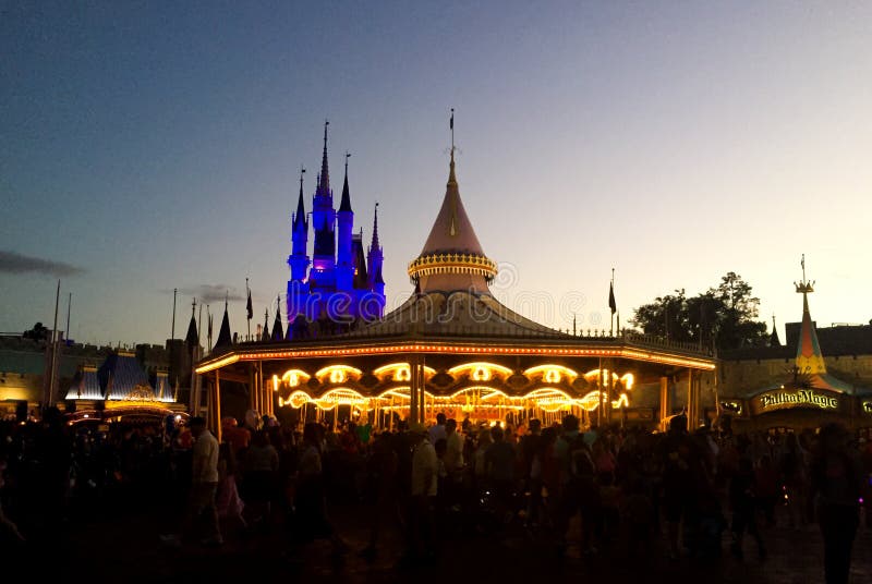 Carousel and Cinderella`s Castle at Magic Kingdom with at Disney World, Orlando, Florida at night. Carousel and Cinderella`s Castle at Magic Kingdom with at Disney World, Orlando, Florida at night.