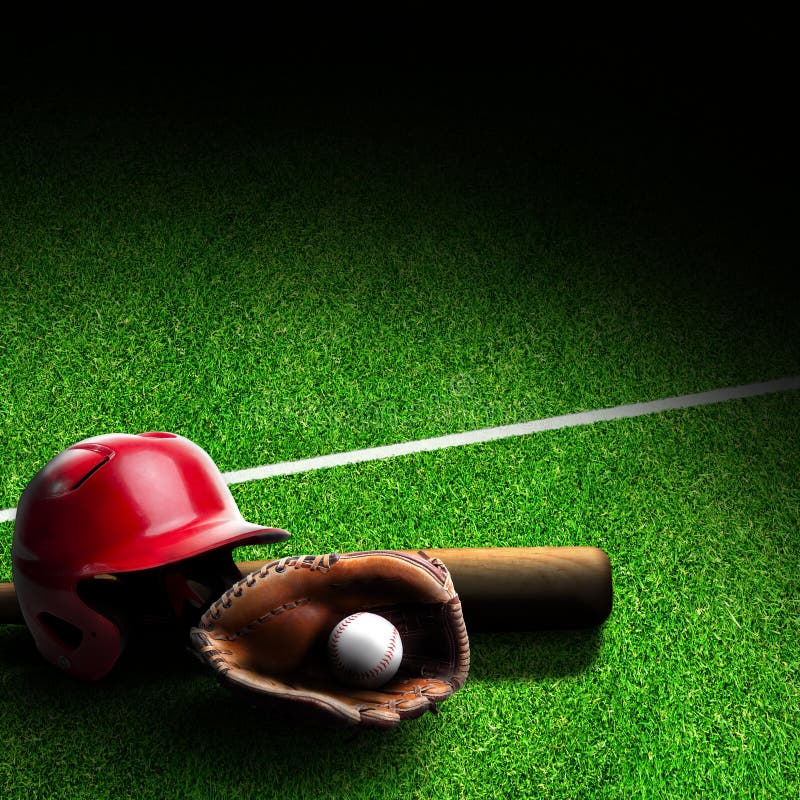 Baseball helmet, bat, glove and ball on grass field with marking. Dramatic spot lighting effect and copy space. Baseball helmet, bat, glove and ball on grass field with marking. Dramatic spot lighting effect and copy space.